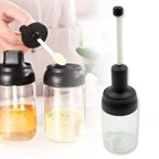 Durable glass seasoning jar with spoon for spices.