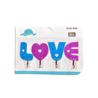 Set of love-shaped self-adhesive hooks for home decoration.